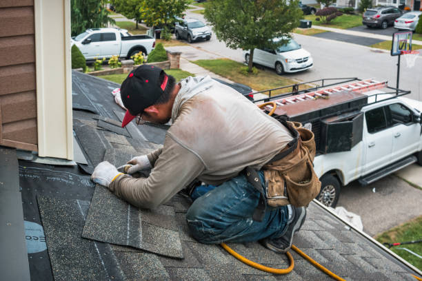 Professional Roof Replacement technician working in Tishomingo, OK